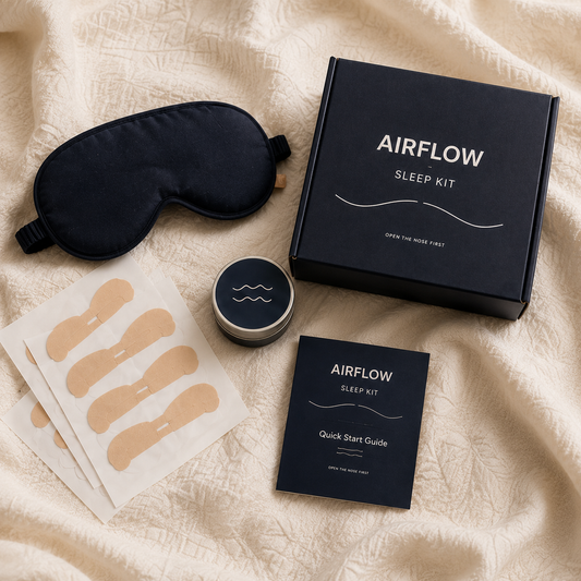Airflow Sleep Kit flat lay with nasal strips sleep mask travel tin and quick start guide