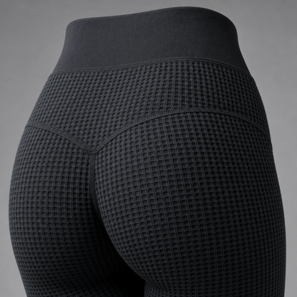 Close-up of the rear waistband and contour seams on the DriveOn Shadow-Knit Contour Leggings, showing the charcoal shadow-knit texture