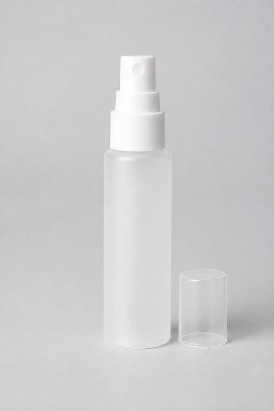 SPF 50+ Hydrating Glow Mist travel size, a 30ml frosted mist bottle with a fine-mist pump and clear cap